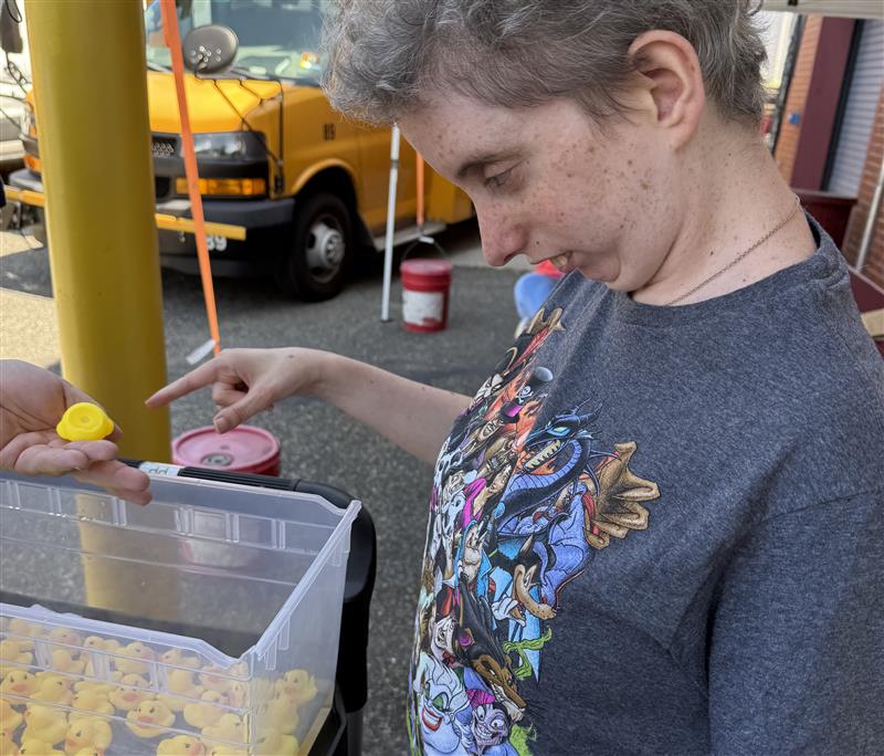 Client engages in a carnival game